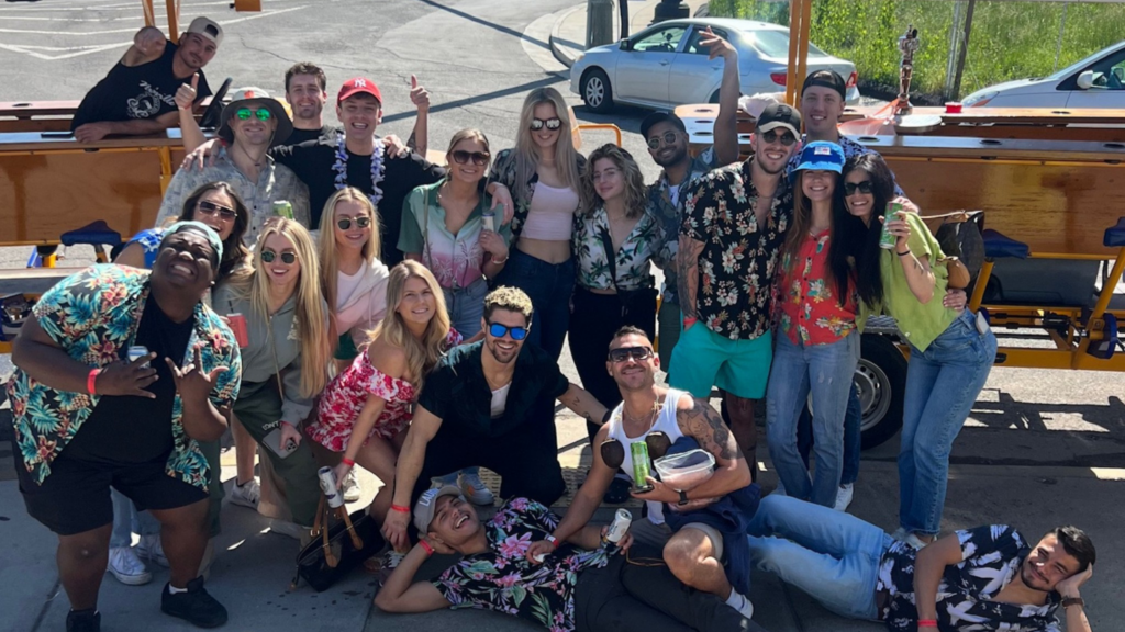 Group of Nashville Pedal Tavern customers celebrating in front of the bike bars