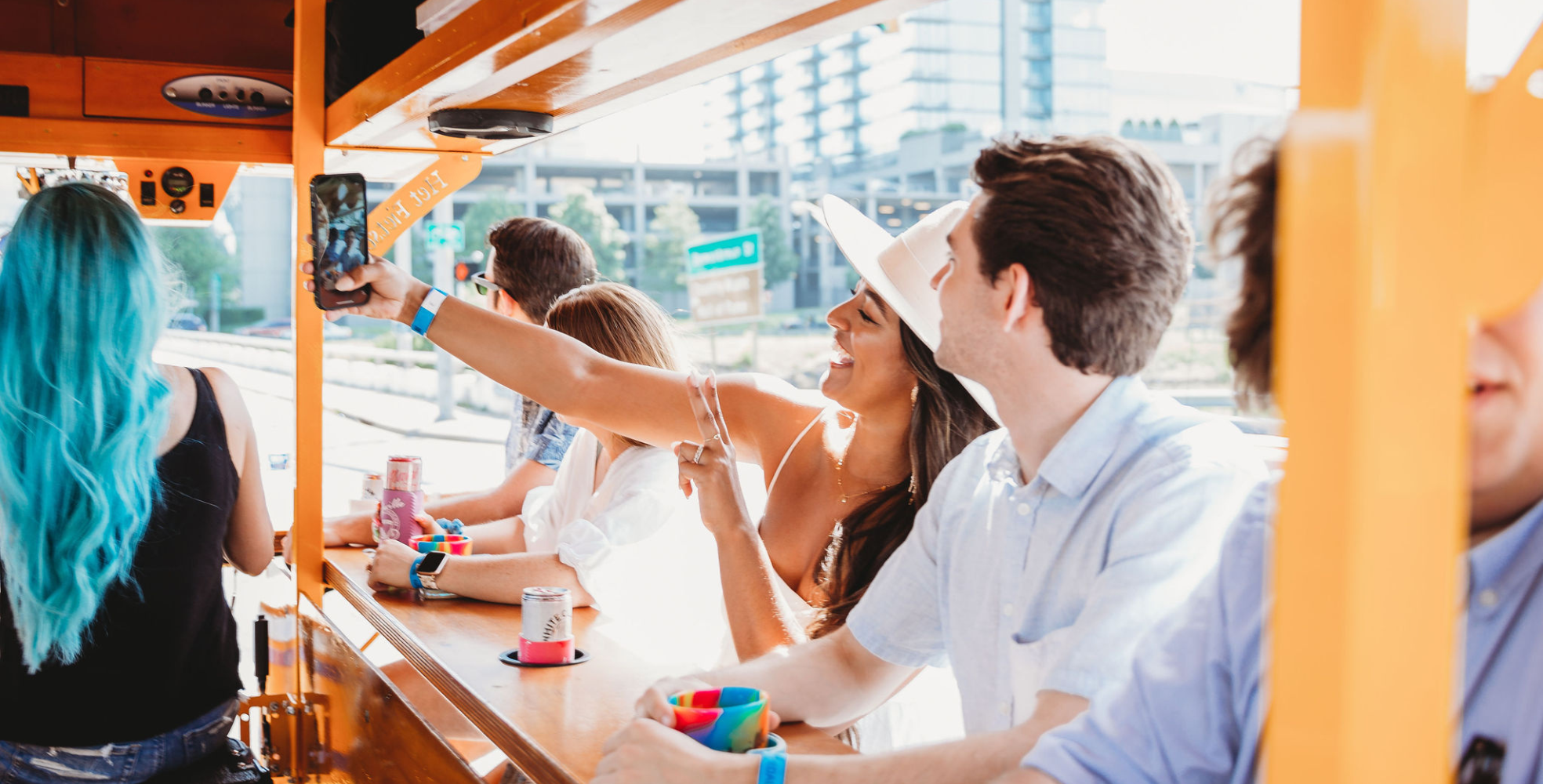 group pedaling on nashville pedal tavern with girl taking a selfie