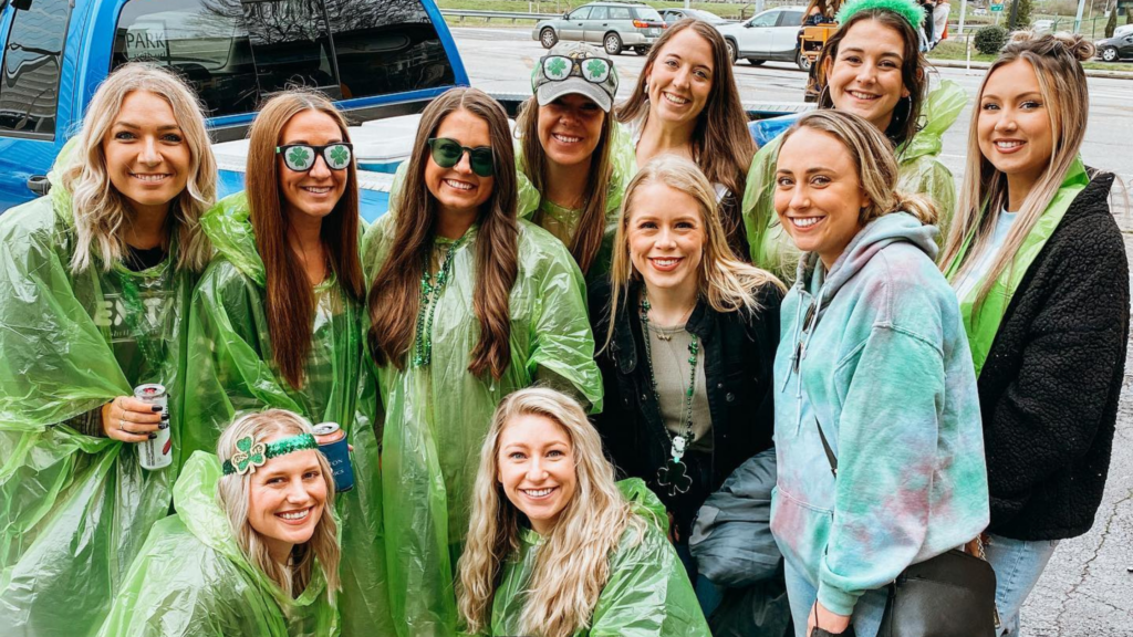 group of women wearing rain ponchos on a nashville pedal tavern tour 